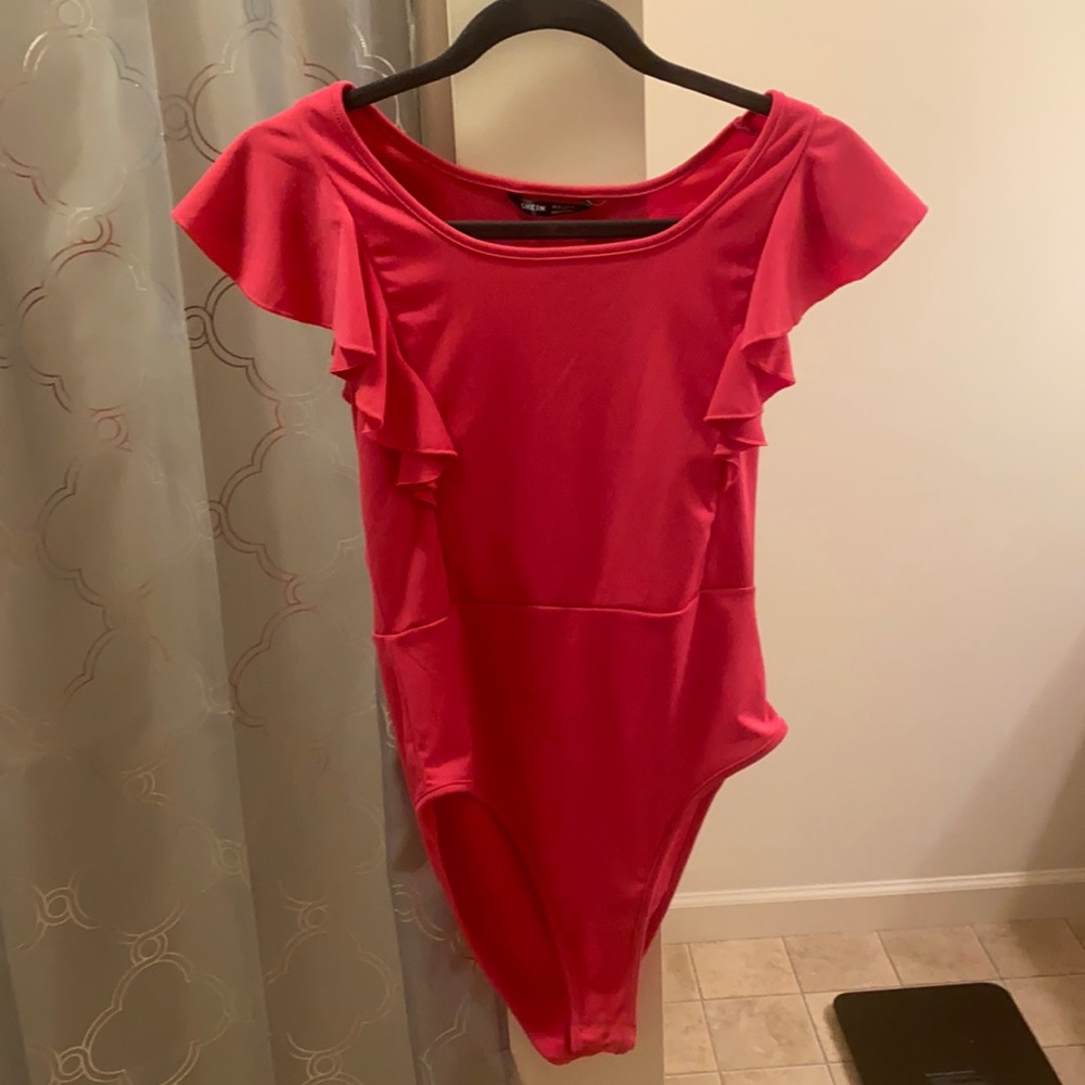 Size medium pink body suite never worn